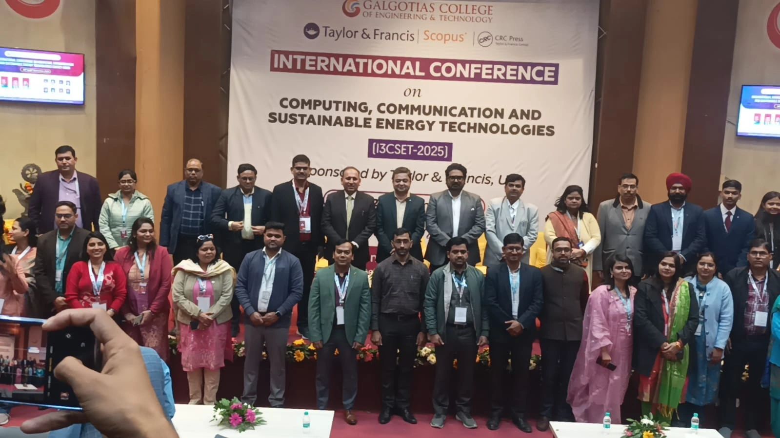 I3CSET‑2025 — Full delegate & faculty group photograph on stage at the International Conference on Computing, Communication & Sustainable Energy Technologies.